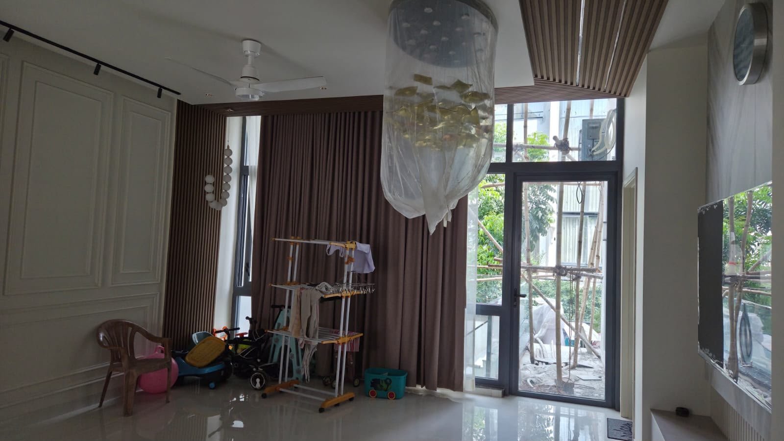 Living room with curtains and fluted wall panels